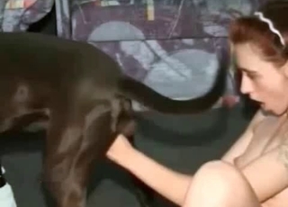 Redhead stimulates her doggy