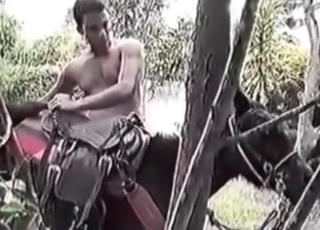 Man zoophile plays with a dog