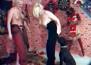 Two girls and their black dog