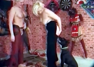 Two girls and their black dog