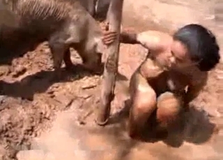 Dirt-covered Latina stalks a kinky pig